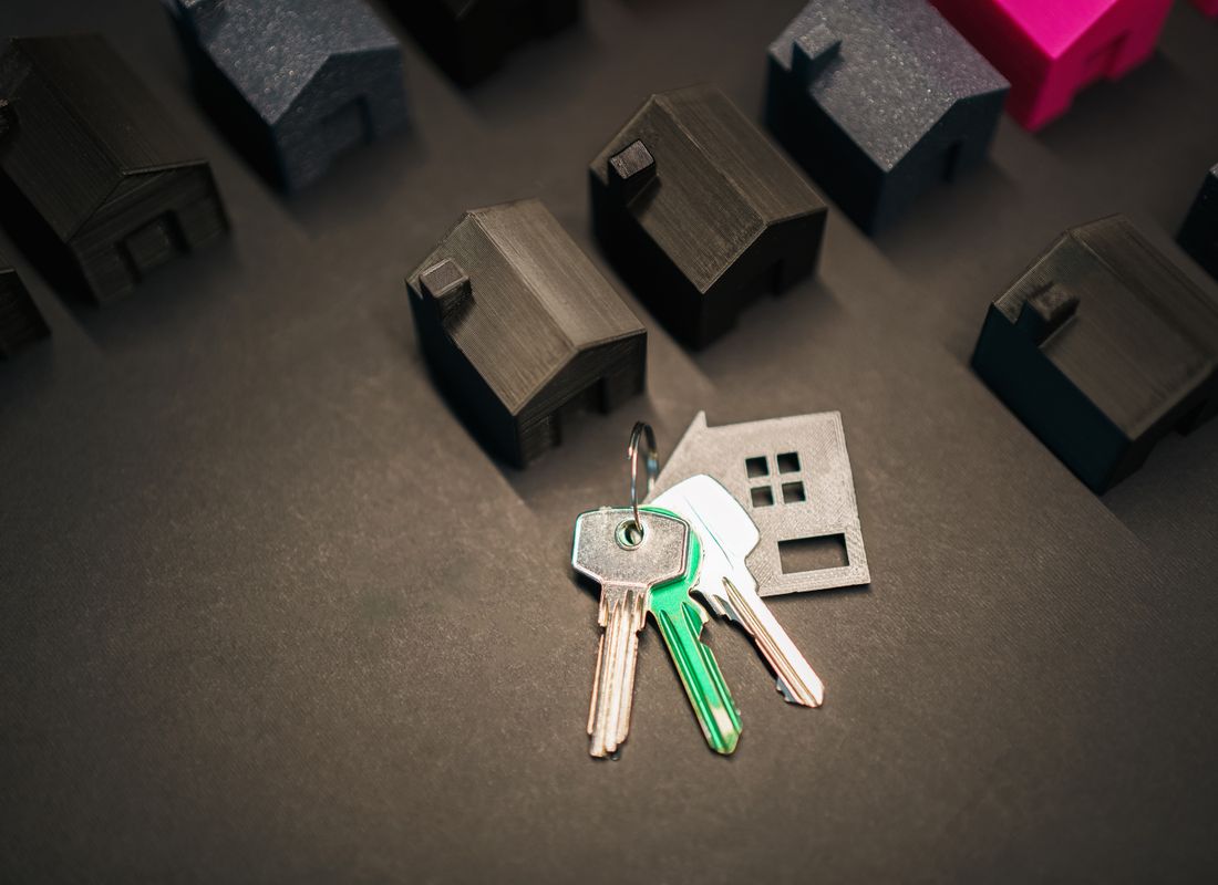 House keys and closing paperwork on a desk